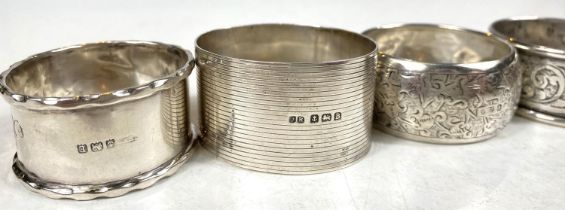 8 hallmarked silver napkin rings, various designs, dates and assay offices, 102gm