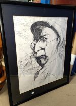 A pen and ink portrait of a man in a cap, drawn by a psychologist, framed and glazed