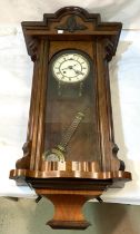 A 19th century Vienna wall clock in walnut case, spring driven with strike