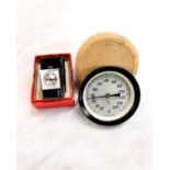 A circular vintage Swedish Fahrenheit thermometer in original box; a STOWA miniature wind up clock/