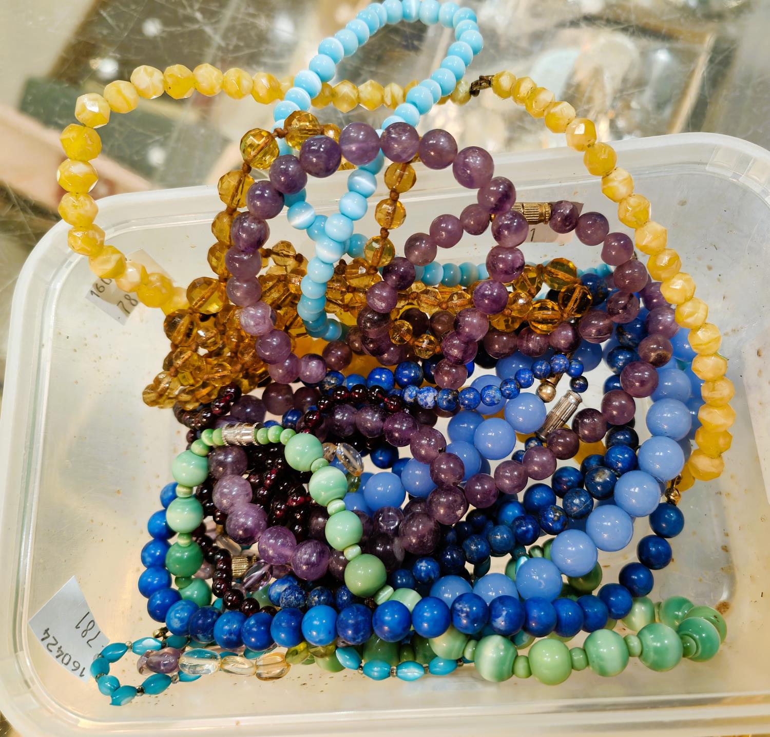 A collection of Amethyst, Lapis Lazuli and other coloured beads