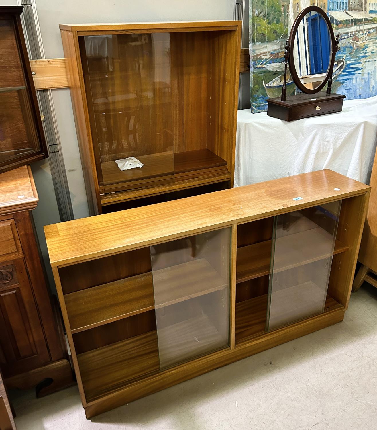 A teak Morris of Glasgow bookcase, ht. 143 x 69cm; a mid century teak book case, length 136cm, ht.