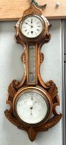 A late Victorian unusual clock/barometer in carved walnut 'anchor' surround, with thermometer