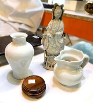 Three pieces of blanc de chine china, a Chinese incised baluster vase with dragons, on stand, height