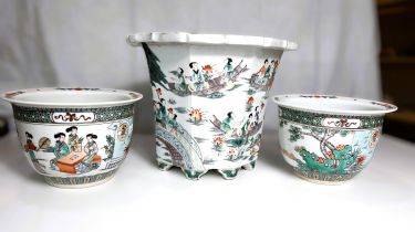 A Chinese octagonal planter with polychrome decoration of garden scenes, height 23cm and a pair of