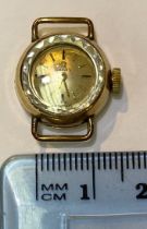 An Omega lady's cocktail watch with small cream face and gold batons, the case stamped '375',