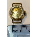 An Omega lady's cocktail watch with small cream face and gold batons, the case stamped '375',