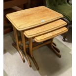 A 1970's/80's nest of teak occasional tables