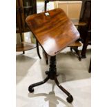 A 19th century mahogany adjustable reading/lecture table, on tripod base with scroll supports (1