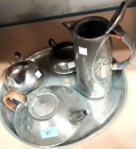 A four piece Liberties Tudric pewter tea service with teapot, hot water jug, milk and sugar No 0231,