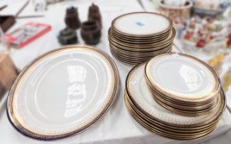 A very large selection of Royal Doulton England Higgins and Seiter blue and gilt dinner, dessert and