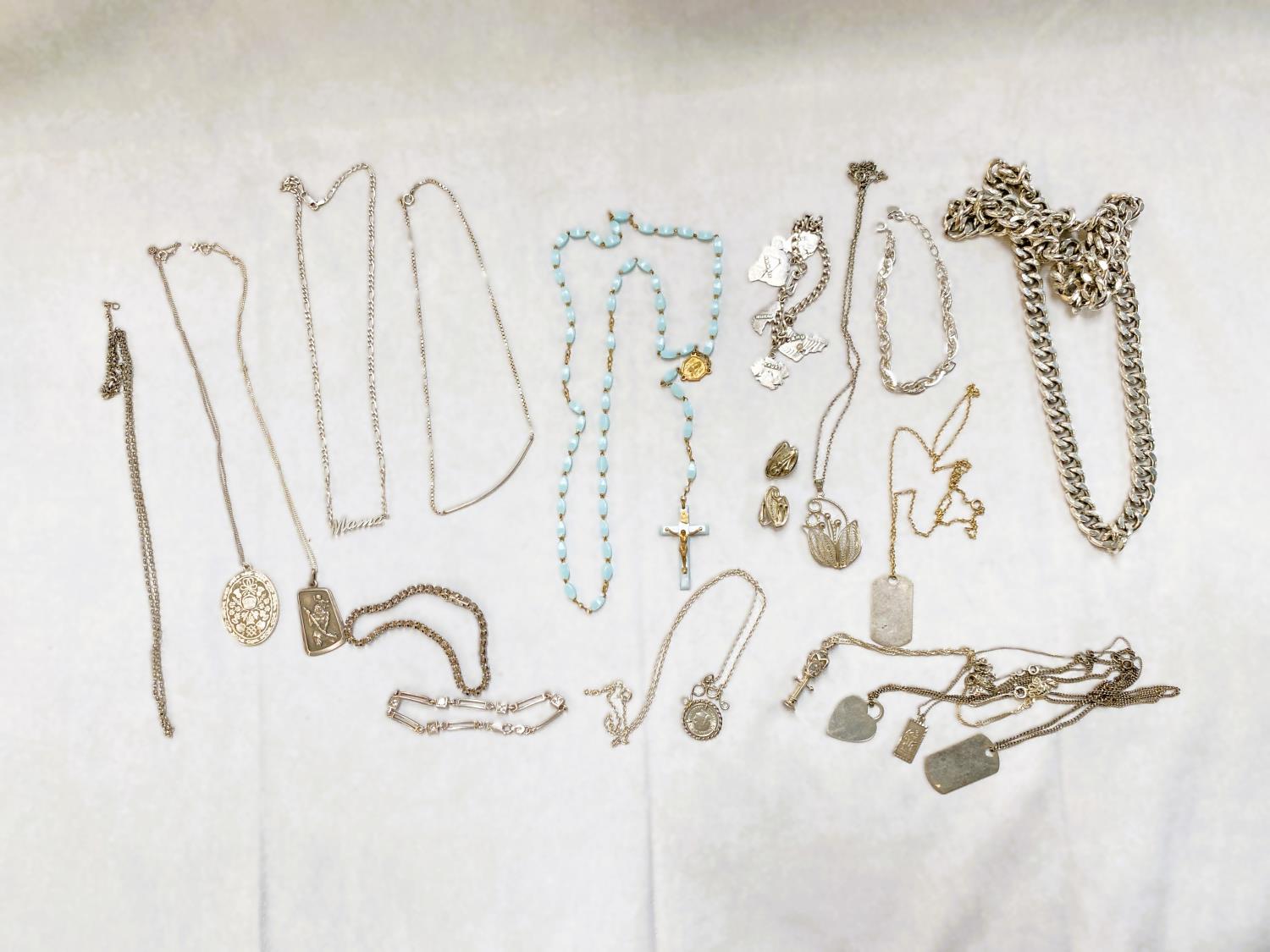 A selection of white metal and other costume jewellery