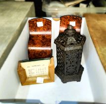 A vintage desk calendar, a pair of birds eye wooden book ends and a cast iron money box