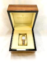 A Dreyfuss & Co. gold plated and stainless steel ladies watch in original box.