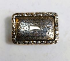 A silver gilt vinaigrette by Nathaniel Mills with all over chased and turned decoration, vacant
