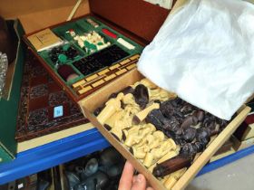 An ornamental "Medieval" chess set and board; a cased games compendium.