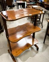 A Victorian mahogany three tier what-not with shaped shelves and supports