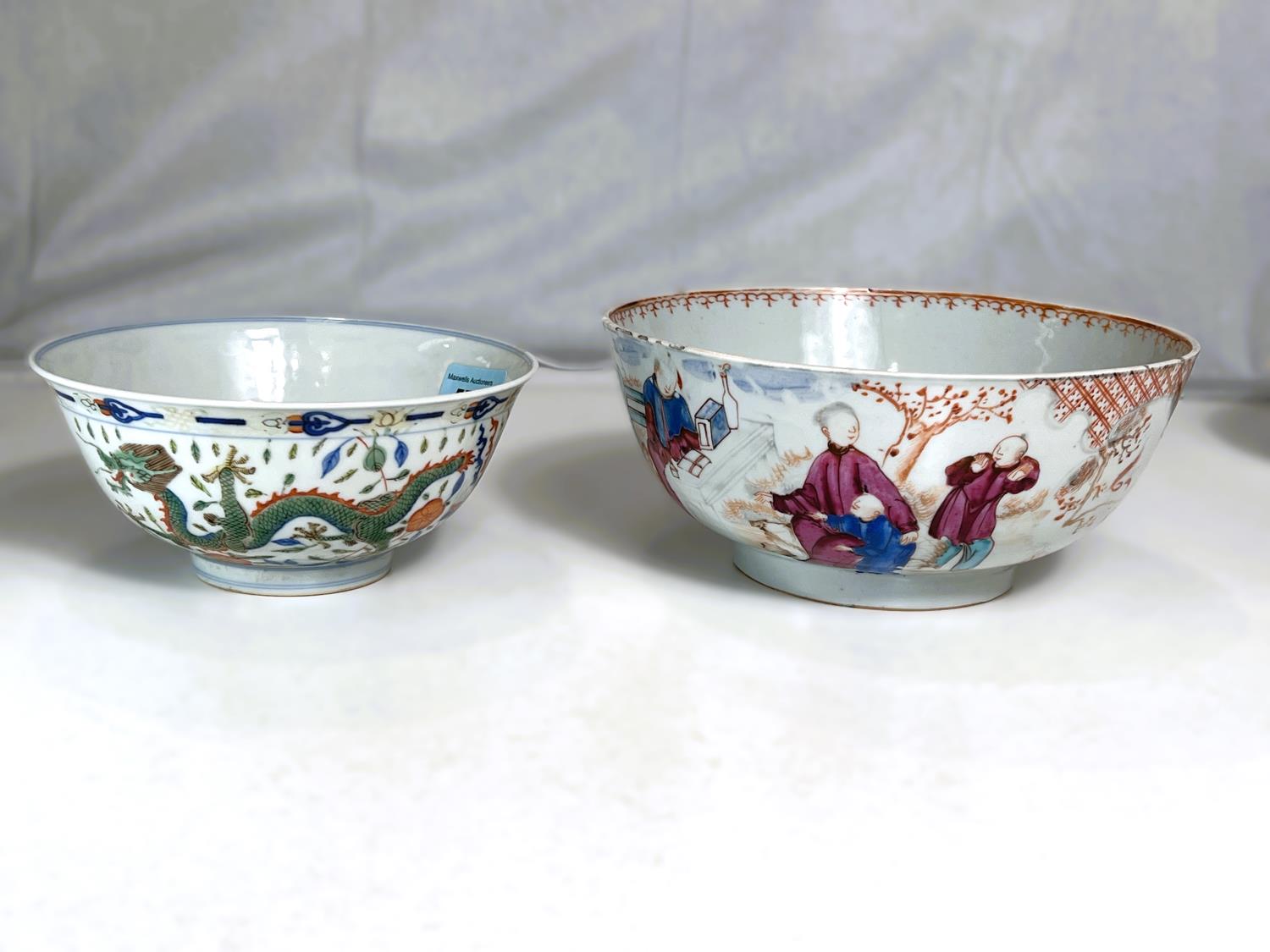 Two Chinese bowls, a bowl decorated with green and orange dragons to the outside and interior dragon