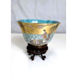 A Chinese shaped square bowl with polychrome enamel decoration of deities on islands and choppy