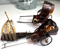 Three Chinese tortoise shell items, a sailing boat and two pull along rickshaws