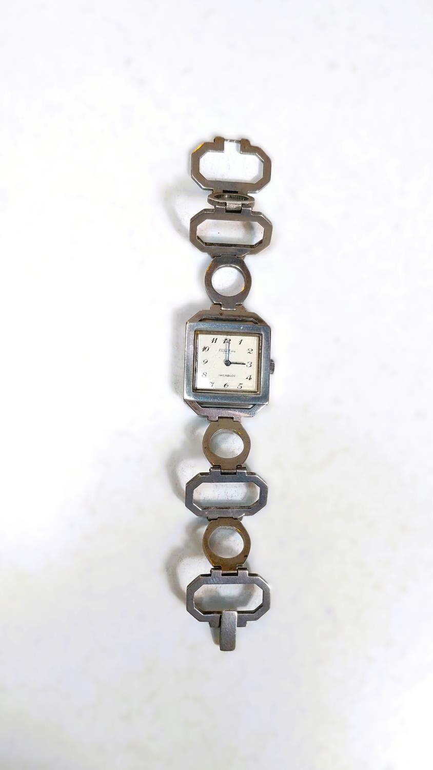 A 1970 Fisher Extra white metal watch in the manor of Roy King, loop bracelet