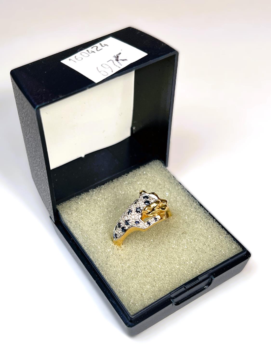 An 18ct gold dress ring in the form of tiger set with diamond chips and sapphires, with green - Image 2 of 3
