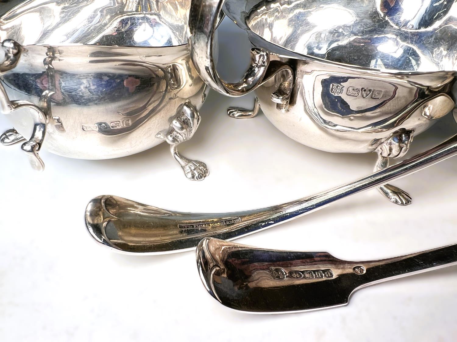 A matching pair of hallmarked silver sauce boats with cut rims and triple paw feet, Birmingham - Image 3 of 3