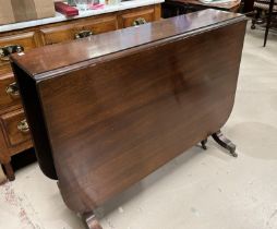 A 19th century mahogany Pembroke table of rounded rectangular form, extended length 135cm, reeded