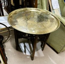 A 19th / 20th century Eastern brass table woth folding wood legs