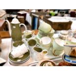 A Susie Cooper coffee service with various colours and spots; an Art Deco floral service, a Queen