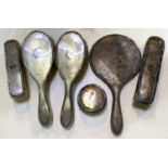 A collection of hallmarked silver backed brushes and mirrors