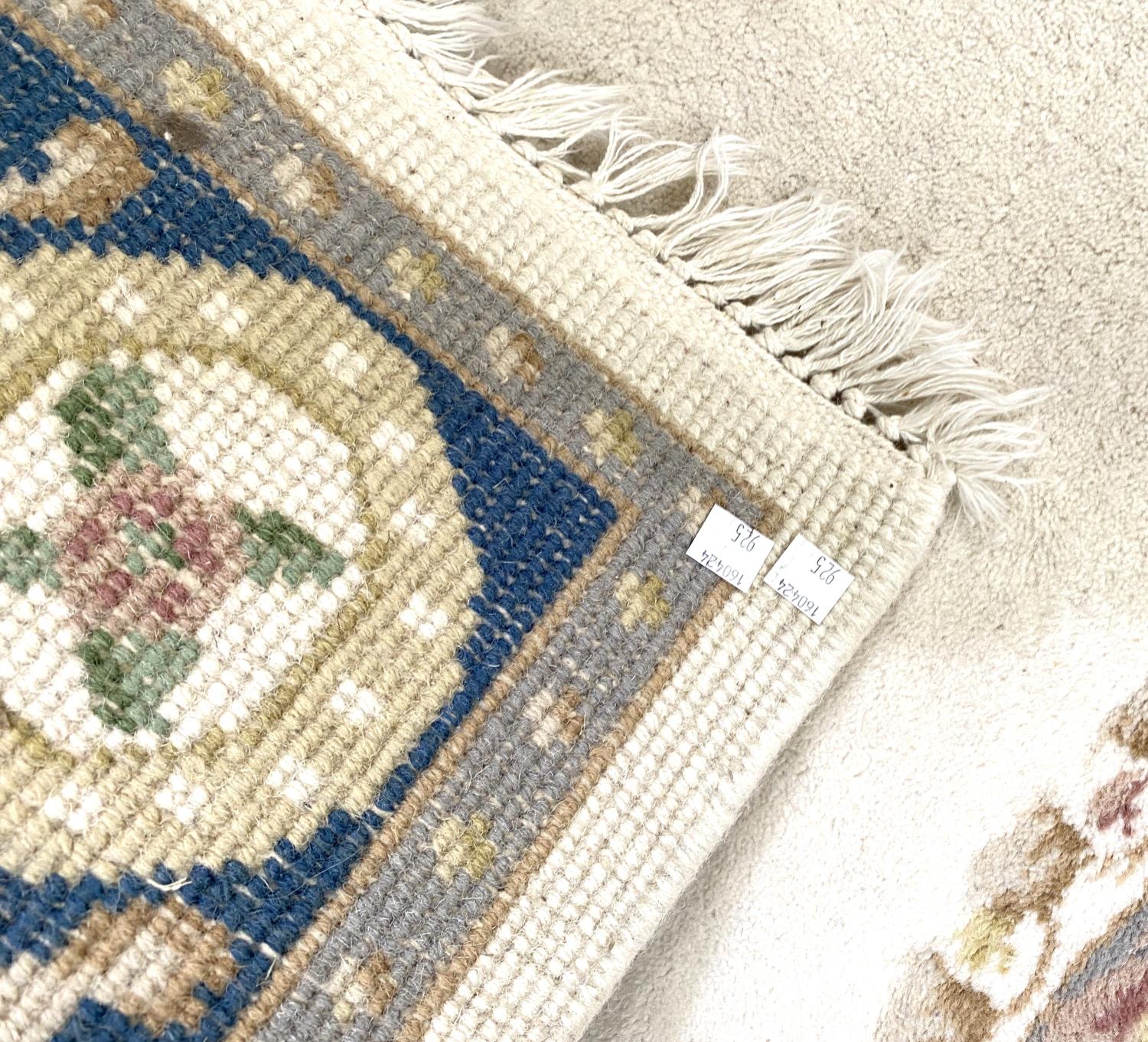 A pair of modern Indian Kayam rugs, with floral pattern on a cream ground, 186cm - Image 4 of 4