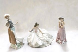 A Lladro group:  seated girl in ballgown, impressed 5859, width 18cm; 2 Lladro figures:  girl with
