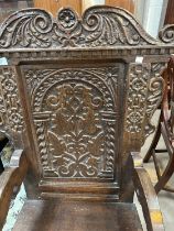 A 17th century style carved oak wainscot chair.