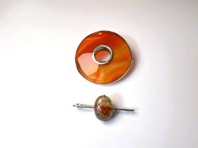 A Victorian banded agate Celtic style brooch with silver mounts (not hallmarked); an early 20th moss