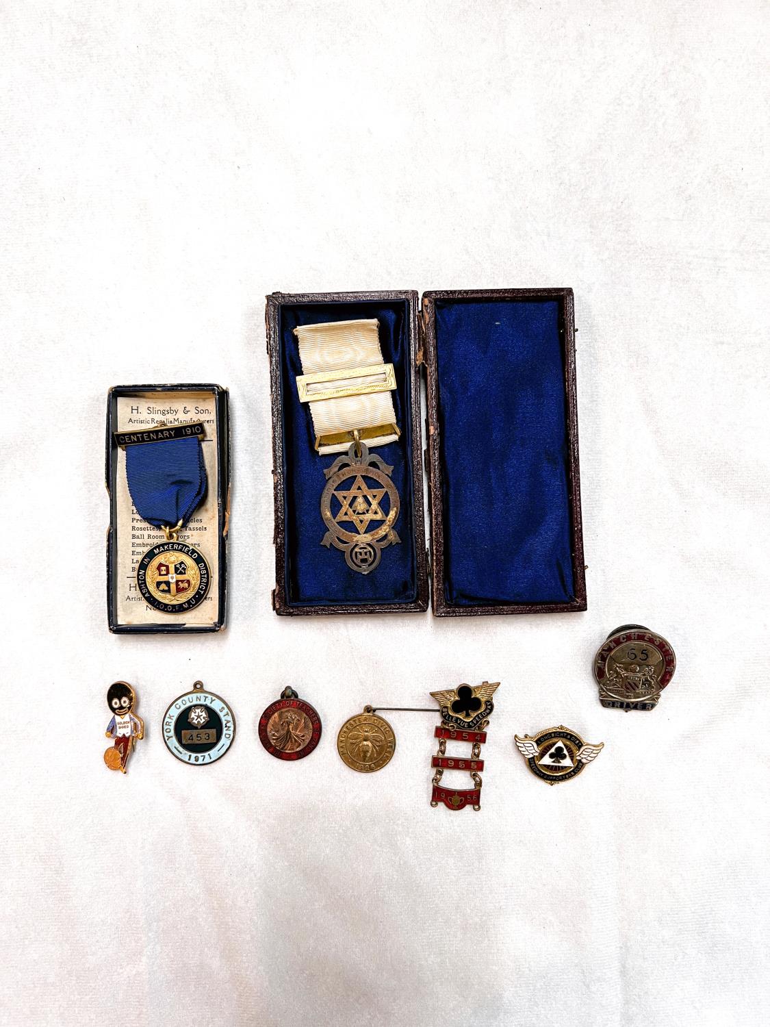 A hallmarked silver Masonic medal in case (case a.f) a variety of non military badges etc