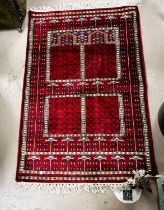 A modern red ground hand knotted Persian rug, length 200cm