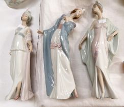 Three Lladro figures of women in Art Deco dresses and hats