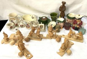 A collection of carved wooden animals playing instruments with movement, Armorial goss items and