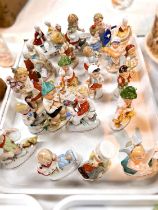 A collection of continental miniature porcelain figures of children