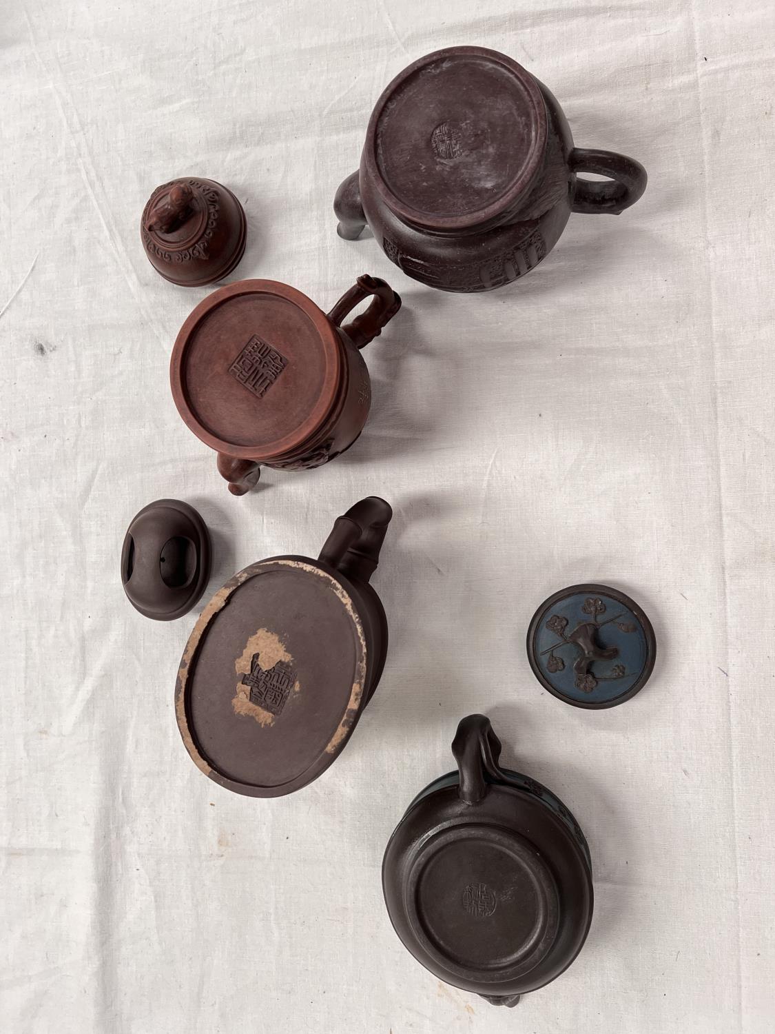 A Yixing teapot, no lid, impressed mark to base, height 10cm; a similar squat teapot with lid; - Image 4 of 4