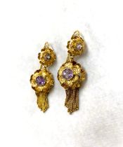 A pair of vintage yellow metal earrings formed from flower head with amethyst and 'brushed'