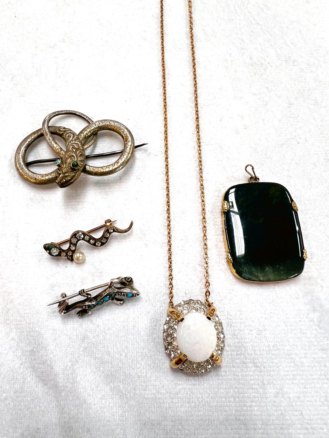 Vintage costume jewellery including a coiled snake with turquoise eyes, a snake set clear paste