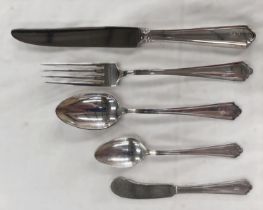 An American white metal part canteen of cutlery with reeded borders and dog nose terminals, each