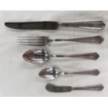 An American white metal part canteen of cutlery with reeded borders and dog nose terminals, each