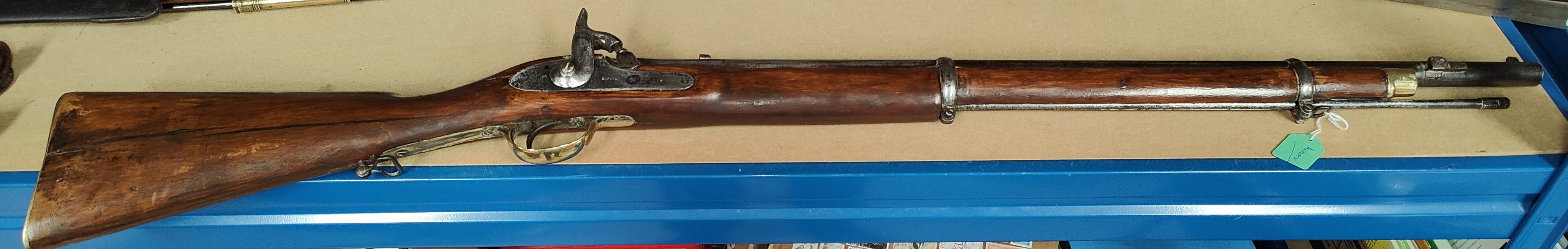 A two band rifle with percussion cap, lock plate stamped Enfield, length 113cm.