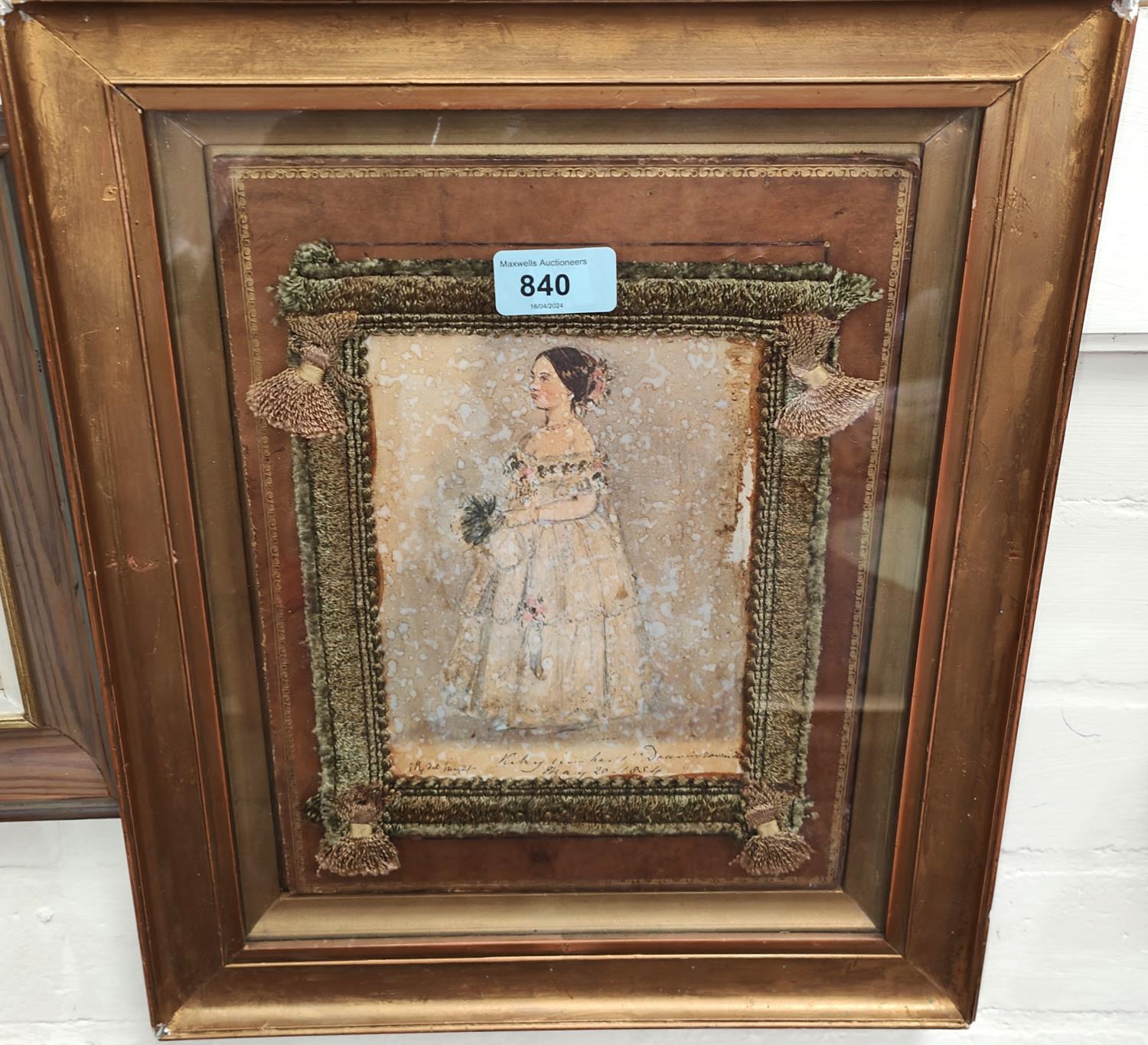 A Victorian watercolour portrait of a bride, dated May 20th 1854, with cushion surround, in guilt