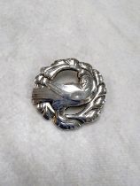 Georg Jensen:  a circular brooch with dove, stamped '925 sterling, 123', 4.5cm