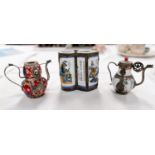 A Japanese double gourd shaped red ground teapot with white metal handle and spout, lion mask and