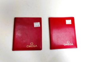 Omega - two Speedmaster booklets in wallets